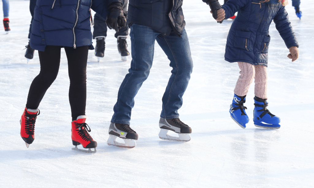 3 people ice-skating in Breckenridge, Colorado 