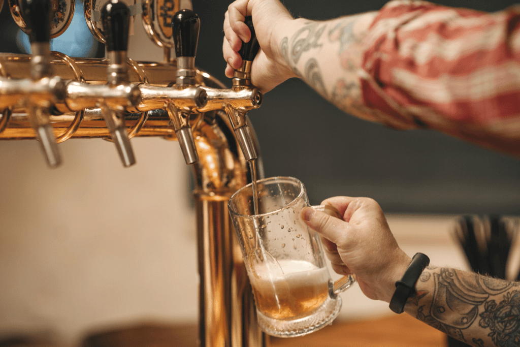 Bartender pouring a draft beer at a brewery in Breckenridge.